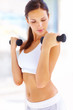 Heath concepts - Woman working out with free weights Heath concepts - Woman working out with free weights