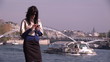 Video: Businesswoman making a cellphone call along the Seine river Businesswoman making a cellphone call along the Seine river