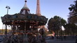 A carousel in front of the Eiffel tower