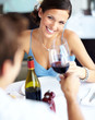 Beautiful young woman looking at her boyfriend with love and toa