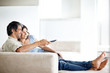 Foto: Relaxed mature couple watching tv at home Relaxed mature couple watching tv at home