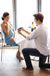 Will you marry me - Boyfriend proposing to girlfriend at a resta