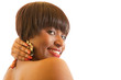 Young woman holding back of neck and smiling