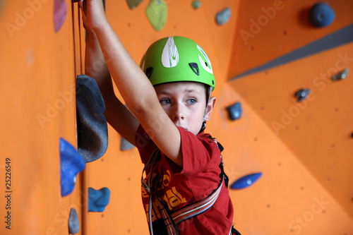 Photo: Boy on climbing wall Boy on climbing wall