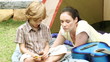 loving mother with son during camping