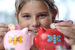 Photo: School girl and piggy bank School girl and piggy bank