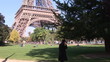 Man talking on phone at the Eiffel Tower in Paris
