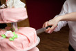 cut of a slice of a wedding cake