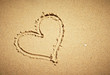 Heart drawn on sand. Horizontal composition.