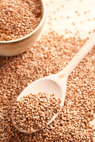 Photo: buckwheat in wooden spoon buckwheat in wooden spoon