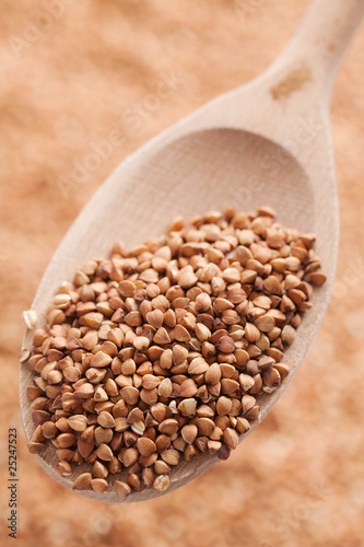 Photo: buckwheat in wooden spoon buckwheat in wooden spoon