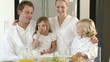 mother joining her family at breakfast