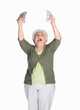 Mature woman holding dollars and shouting against white