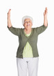 Happy mature woman with hands raised isolated against white
