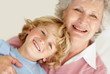 Closeup of a happy child with his caring grandmother