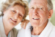 Loving elderly blur woman with a happy senior man smiling