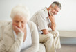 Worried mature man looking at a sad senior woman