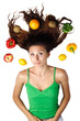 Beautiful woman lying with fruits hair is dishevelled isolated