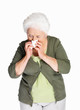 Senior woman using a tissue paper isolated against white