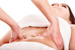 Beautiful  girl having stomach massage.