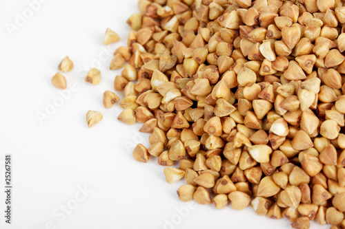 Photo: Buckwheat seeds closeup isolated on white Buckwheat seeds closeup isolated on white