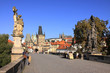 Statue on the Charles Bridge with Prague Castle
