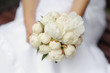 Bride holding peonies wedding bouquet