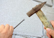 Old Hammer Driving a Nail