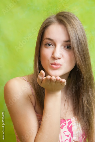 Photo: Air-kissing long-haired teen girl Air-kissing long-haired teen girl