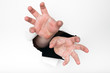 hands grasping through a hole