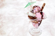 Nice glass cup of ice cream on bright background
