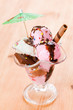 Ice cream on glass cup on wooden background