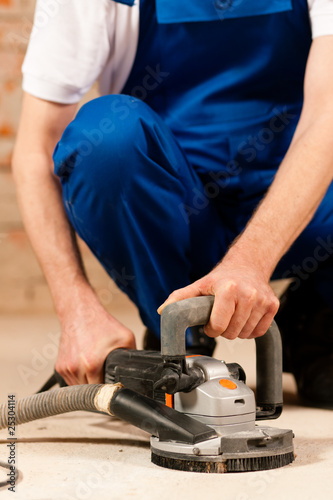 Photo: Grinding the cement floor Grinding the cement floor