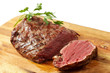 roasted meat on a cutting board. isolated object roasted meat on a cutting board. isolated object