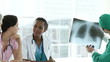 serious medical team studying an x-ray