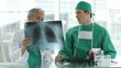 two doctors looking an x-ray