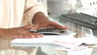 close-up of an afican woman doing her accounts