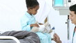 Positive doctor checking little boy's reflex
