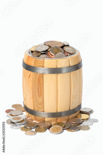 Photo: overflowing barrel with various coins overflowing barrel with various coins