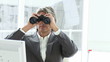 manager looking through spyglasses sitting in his office