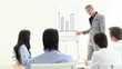 handsome manager explaining graphs during presentation