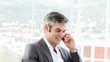 confident businessman on phone in his office