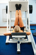 girl on leg machine