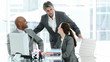 Confident business partners working at a computer