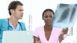 young doctors looking at x-ray