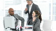 Two colleagues and their manager working at a computer