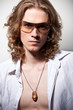 Portrait of long-haired handsome man in sunglasses