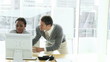 businesswoman at a computer having an argument with colleague