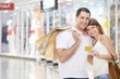 Couple in store with a credit card Couple in store with a credit card