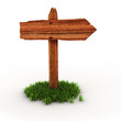 old wooden empty signpost on grass old wooden empty signpost on grass